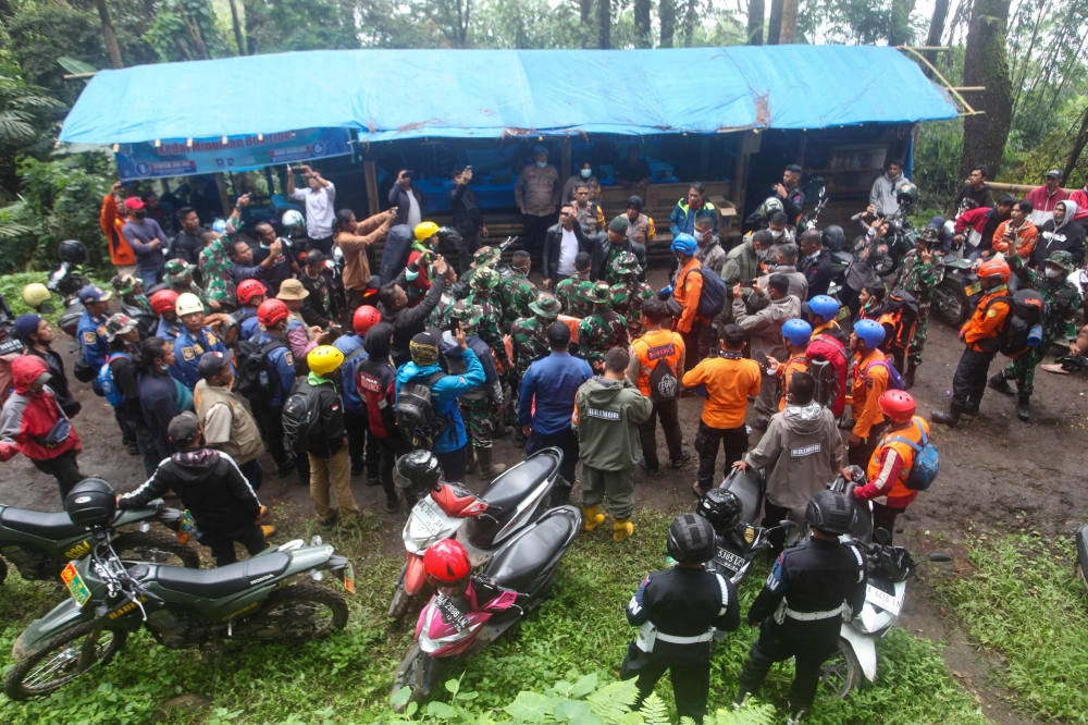 Rescuers prepare for a search and rescue operation after Mount Marapi erupted near Batu Palano village in Agam on December 4, 2023. — AFP pic