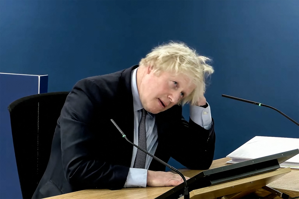 A video grab from footage broadcast by the UK Covid-19 Inquiry shows Britain's former Prime Minister Boris Johnson speaking at the UK Covid-19 Inquiry, in west London, on December 6, 2023 to give evidence. — UK Covid-19 Inquiry/AFP pic