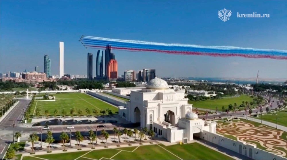Jets release smoke in the colours of the Russian state flag during the arrival of a limousine carrying Russian President Vladimir Putin at Qasr Al Watan, in Abu Dhabi December 6, 2023, in this still image taken from video. — Kremlin.ru handout pic via Reuters