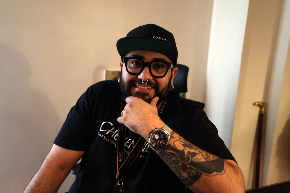 Sean, the owner of a tattoo studio in Iran's capital Tehran, poses for a picture during an interview with AFP on November 7 2023. — AFP pic