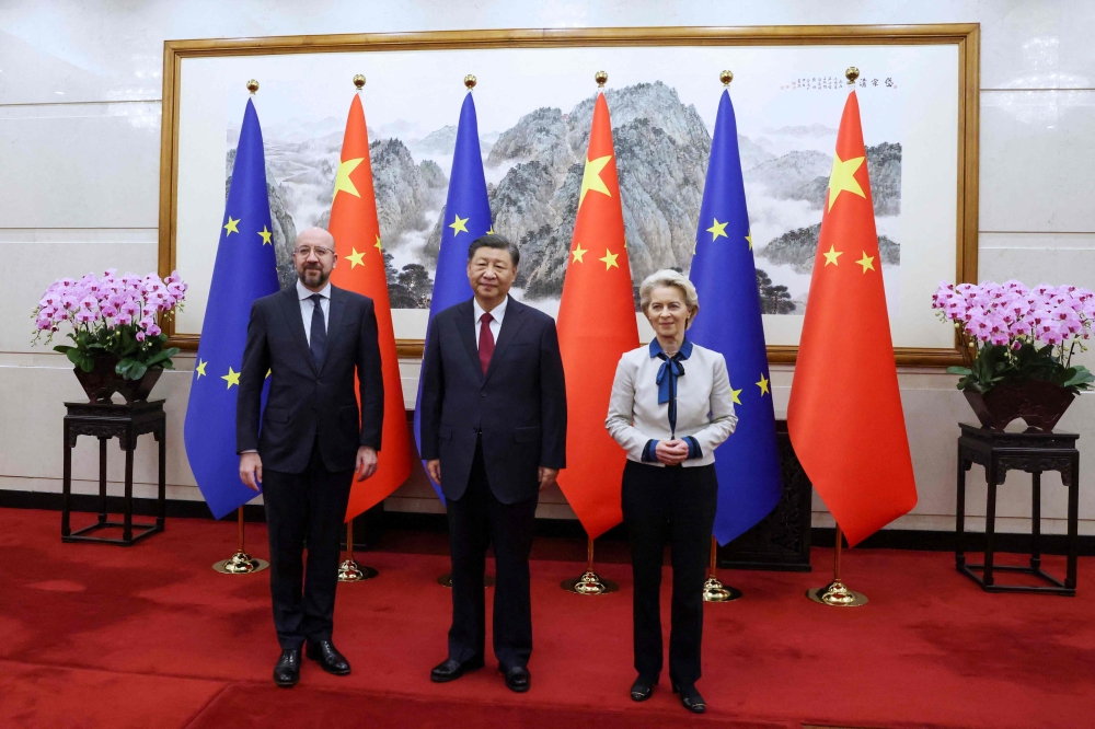 This handout photo taken and released by the European Council Press Service on December 7, 2023 shows China’s President Xi Jinping (centre) receiving European Commission President Ursula von der Leyen (right) and European Council President Charles Michel ahead of the 24th EU-China Summit in Beijing. — European Council Press Service/Dario Pignatelli/AFP pic