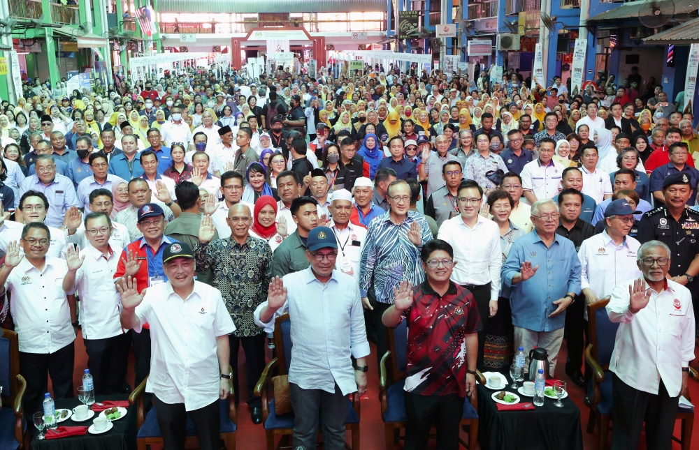 Prime Minister Datuk Seri Anwar Ibrahim at the national hawkers and petty traders carnival day at Buhavan Square in Donggongon, Penampang, December 7, 2023. Anwar said his government is looking into ways to make basic necessities available to all. — Bernama pic 