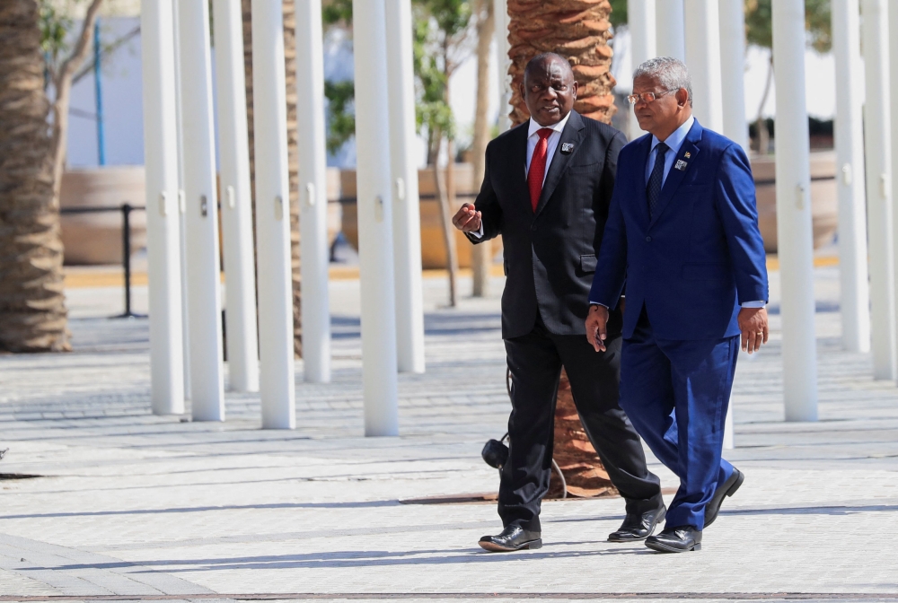 South Africa’s President Cyril Ramaphosa and Seychelles’ President Wavel Ramkalawan walk together after a family photo, ahead of the World Climate Action Summit during the United Nations Climate Change Conference (COP28), in Dubai December 1, 2023. A blast at an explosives store wrecked buildings and caused massive damage to an industrial zone on the Seychelles’ main island Mahe, officials said, prompting the president to declare a state of emergency today. — Reuters pic  