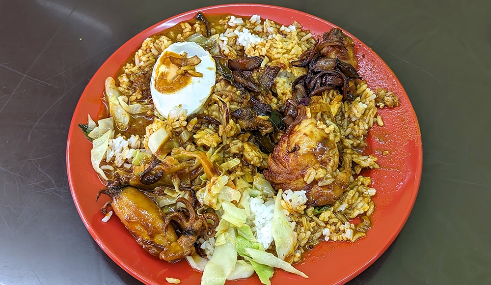 'Nasi kandar' with 'ayam bawang' and 'sotong'.