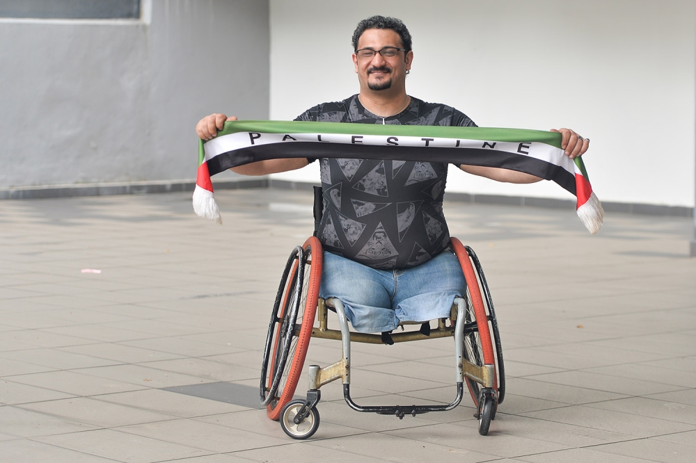 Thaer Jihad Mohamad Mansur was shot multiple times and lost his legs in the Israel-Palestine war in 2006. — Picture by Miera Zulyana