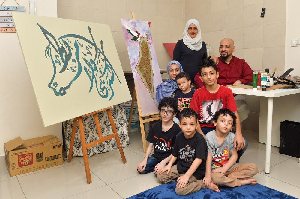 Palestinian artist Abdel Halim Mansour Abu Namous finds Malaysia a safe place for his family to stay amidst the Israel-Palestine war. — Picture by Miera Zulyana