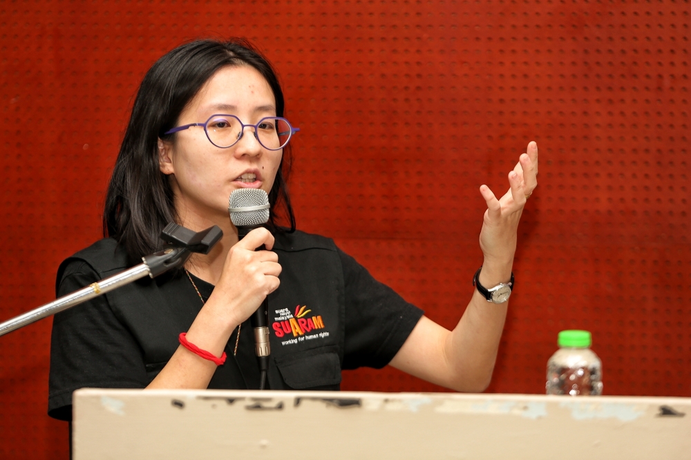 Jernelle Tan Chia Ee, Suaram’s documentation and monitoring coordinator, speaks during a news conference at the launch of the NGO’s Malaysia Human Rights Report 2023 Overview in Kuala Lumpur December 8, 2023. — Picture by Choo Choy May