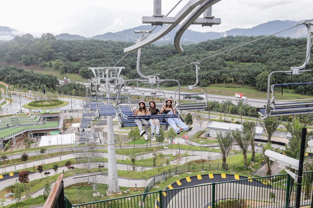 The Skyride is a four-seater chairlift that brings visitors to the top of the hill before they embark down in their luge carts. — Picture by Sayuti Zainudin