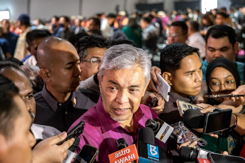 Deputy Prime Minister Datuk Seri Ahmad Zahid Hamidi speaks to the media after the launch of MyNext Technical and Vocational Education and Training (TVET) and the exchange of Memorandum of Cooperation (MoC) between the Malaysian Government, GLCs and private companies at Bukit Jalil National Stadium on December 8, 2023. — Picture by Firdaus Latif