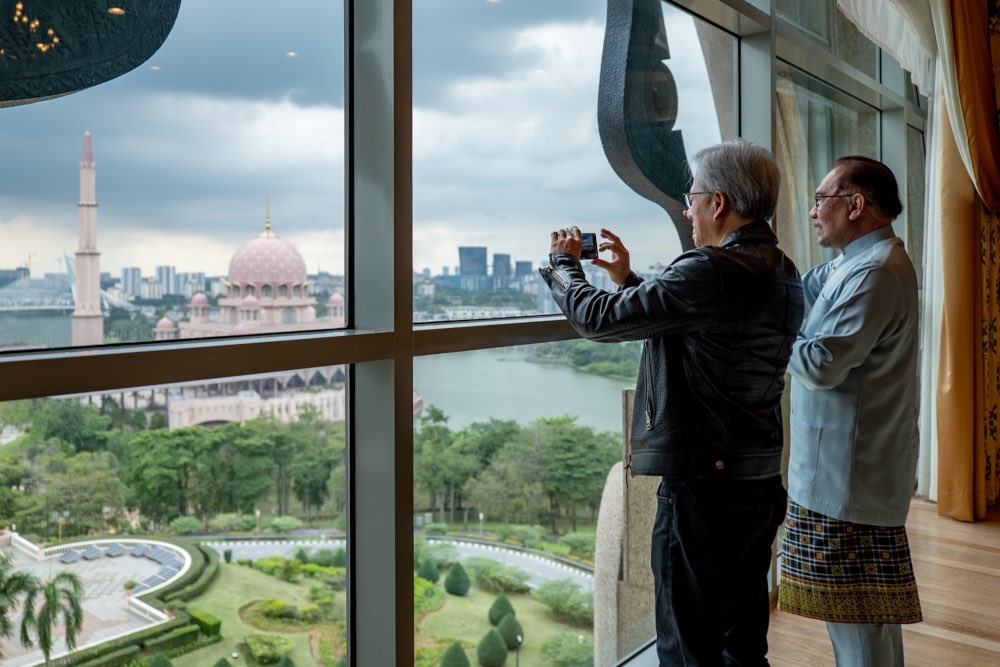 Prime Minister Datuk Seri Anwar Ibrahim and Nvidia chief executive officer Jensen Huang take in the view from Perdana Putra, December 8, 2023. — Picture from X/Anwar Ibrahim   