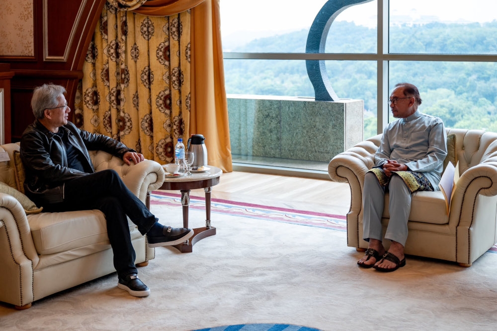 Prime Minister Datuk Seri Anwar Ibrahim and Nvidia chief executive officer Jensen Huang in a discussion. — Picture from X/Anwar Ibrahim   