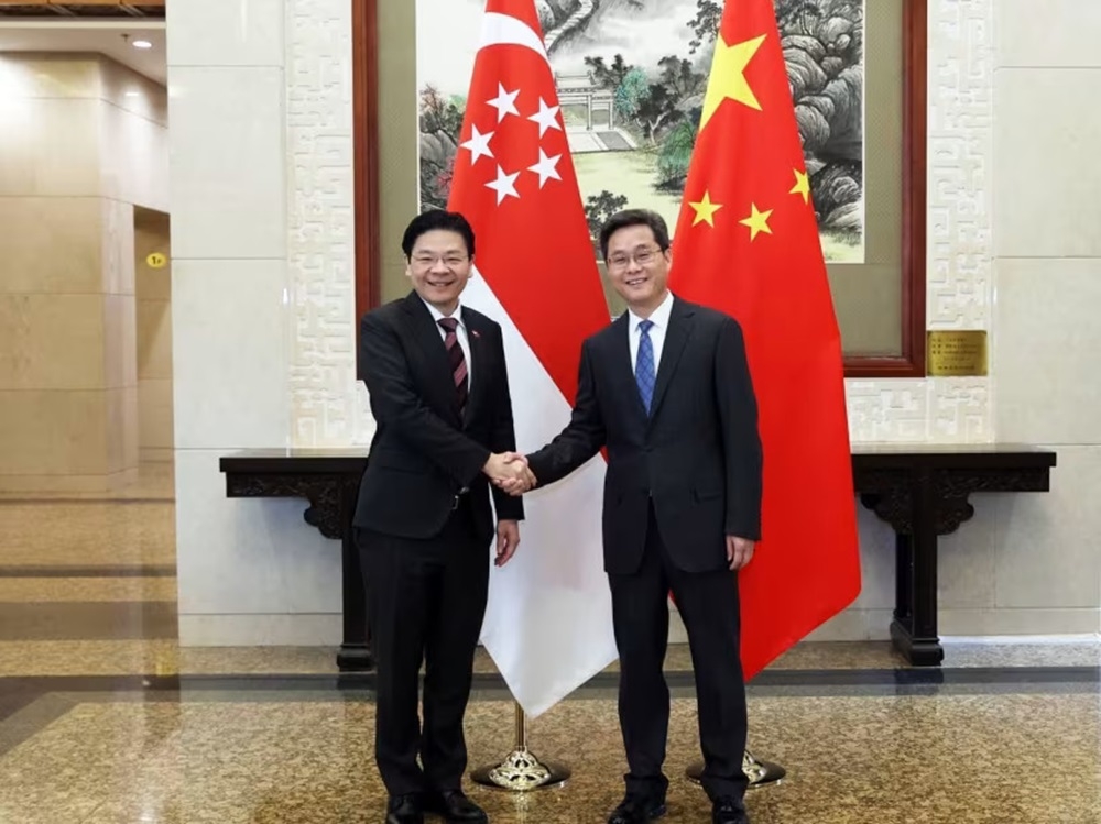 Deputy Prime Minister Lawrence Wong with China's Finance Minister Lan Fo'an during Wong's visit to Beijing. ― TODAY pic