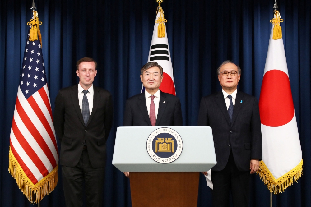 South Korea's National Security Adviser Cho Tae-yong poses with US National Security Adviser Jake Sullivan and Japan's National Security Secretariat Secretary-General Takeo Akiba at the joint press conference at the presidential office, in Seoul December 09, 2023. ― Chung Sung-Jun/Pool via Reuters