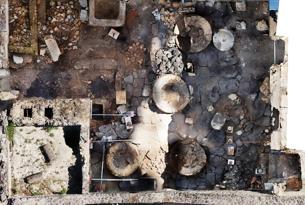 This handout picture released on December 8, 2023 by the Pompeii archaeological park, shows the Regio IX area of the site where a prison-bakery has been discovered, announced the archaeological park on the same day. — AFP pic