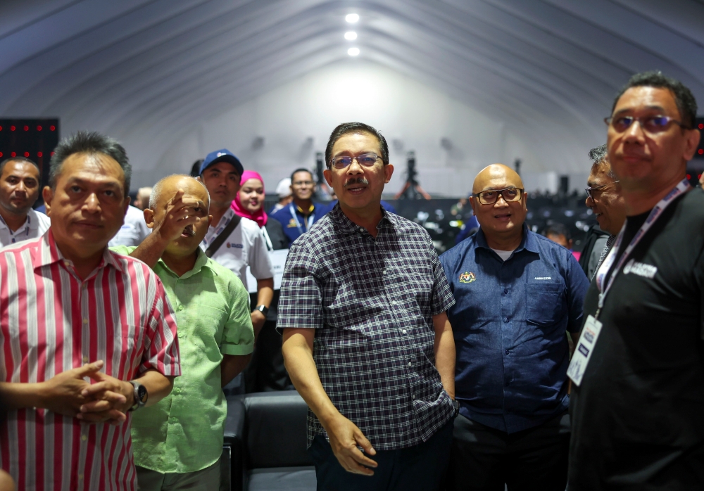 Chief Secretary to the Government Tan Sri Mohd Zuki Ali (3rd left) checks on preparations for the Madani Government One Year Anniversary Programme closing ceremony at Bukit Jalil National Stadium December 9, 2023. — Bernama pic 