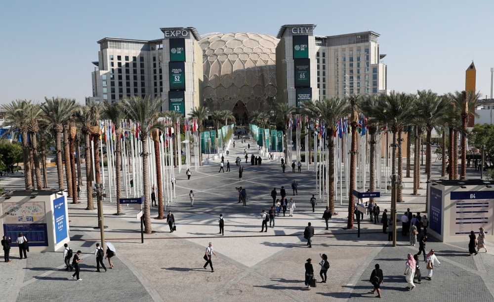 People walk at the Dubai's Expo City during the United Nations Climate Change Conference (COP28) in Dubai, United Arab Emirates, December 9, 2023. REUTERS/Thomas Mukoya