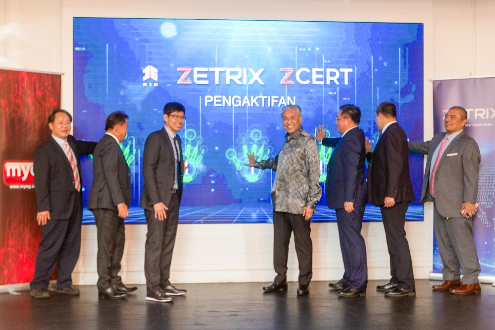 Deputy Prime Minister Datuk Seri Ahmad Zahid Hamidi (4th right) attends the launch of ‘Zcert: Cross-Border Digital Verified Qualification Document System on the Zetrixxinghuo Blockchain’ by MyEG Services Bhd at Ritz Carlton Kuala Lumpur December 9, 2023. — Picture by Raymond Manuel