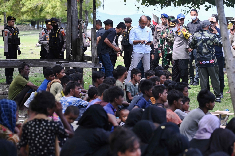 Nearly 200 Rohingya refugees, mostly women and children, were stranded on a beach in western Indonesia today after local authorities said they would not accept the new arrivals. — AFP pic