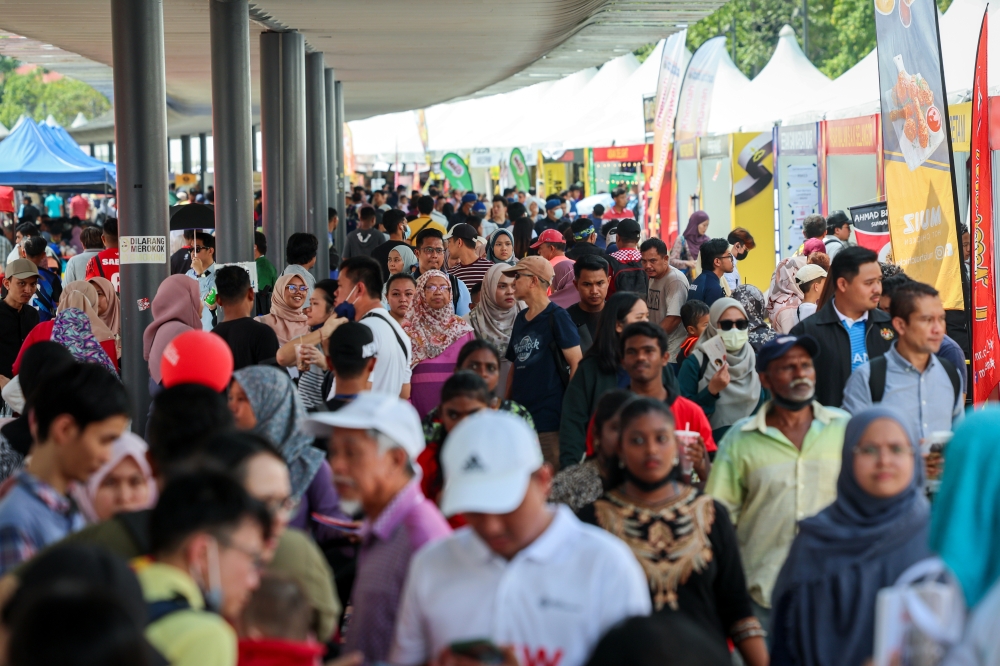People attending the final day of the One Year Program with the Madani Government at the grounds of the Bukit Jalil National Stadium December 10, 2023. — Bernama pic