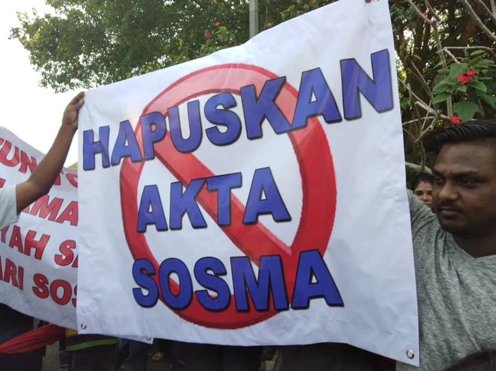 Family members hold banners outside the Sungai Buloh prison in protest in this file photo. — Picture via Facebook/DSM - Desak Sampai Mansuh 
