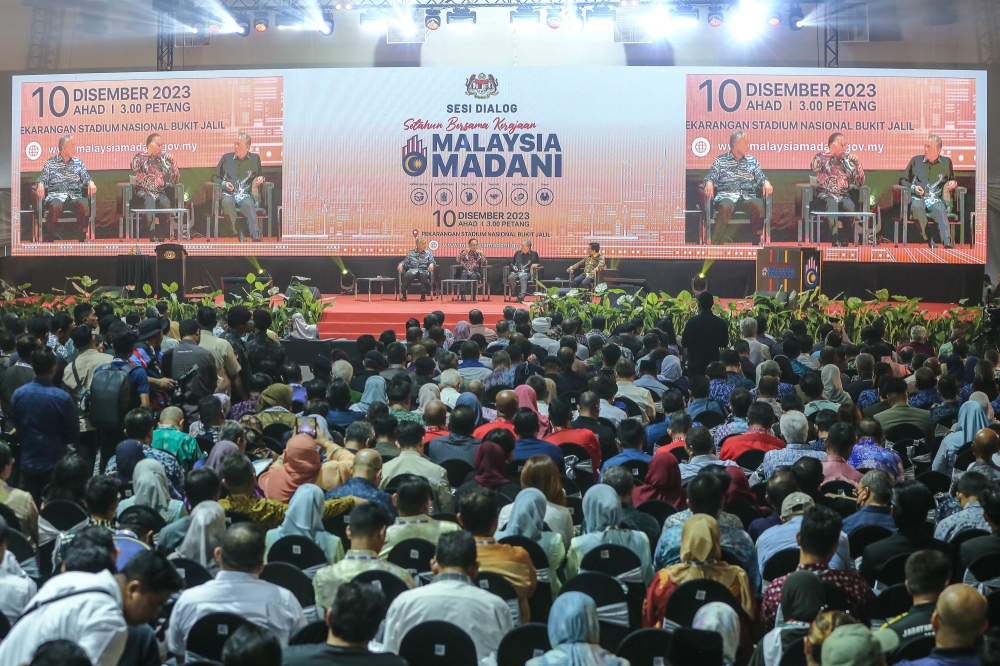 Prime Minister Datuk Seri Anwar Ibrahim (centre) speaks at a dialogue session during the Madani Government One Year Anniversary programme at the Bukit Jalil National Stadium December 10, 2023. — Picture by Yusof Mat Isa