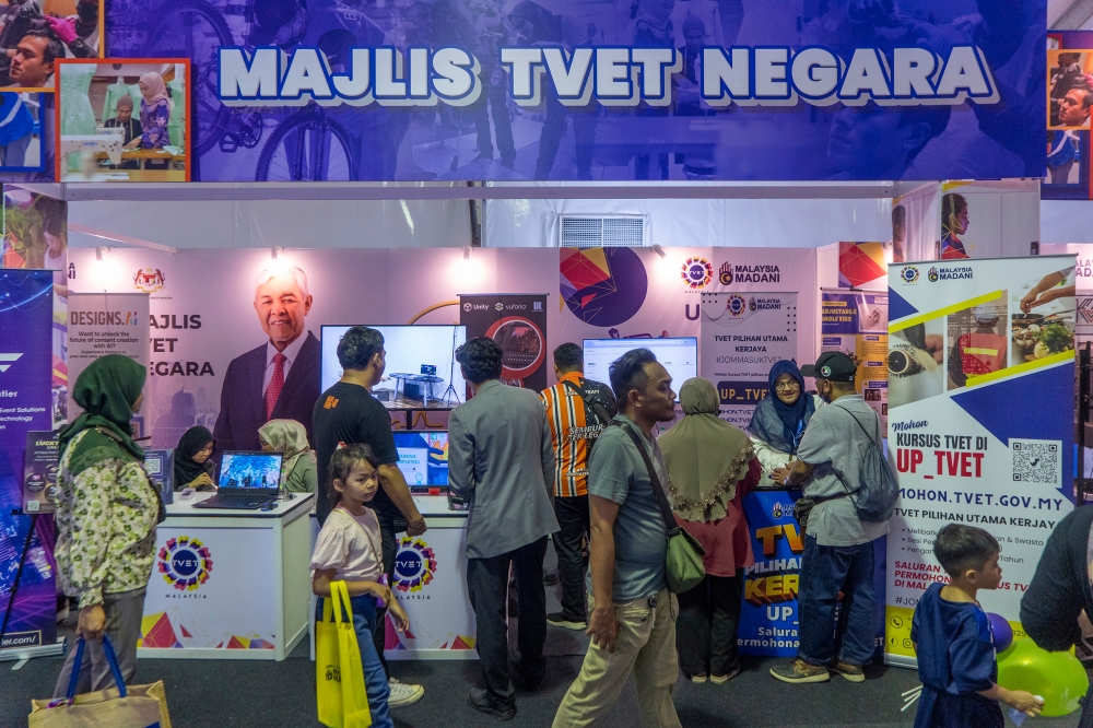 A view of the visitors at the National TVET Council booth during the Madani Government One Year Anniversary Programme at the Bukit Jalil National Stadium December 9, 2023. — Picture by Shafwan Zaidon
