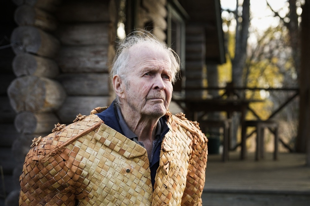 Erkki Pekkarinen posing for a portrait wearing a jacket he made from birch tree bark. — AFP pic