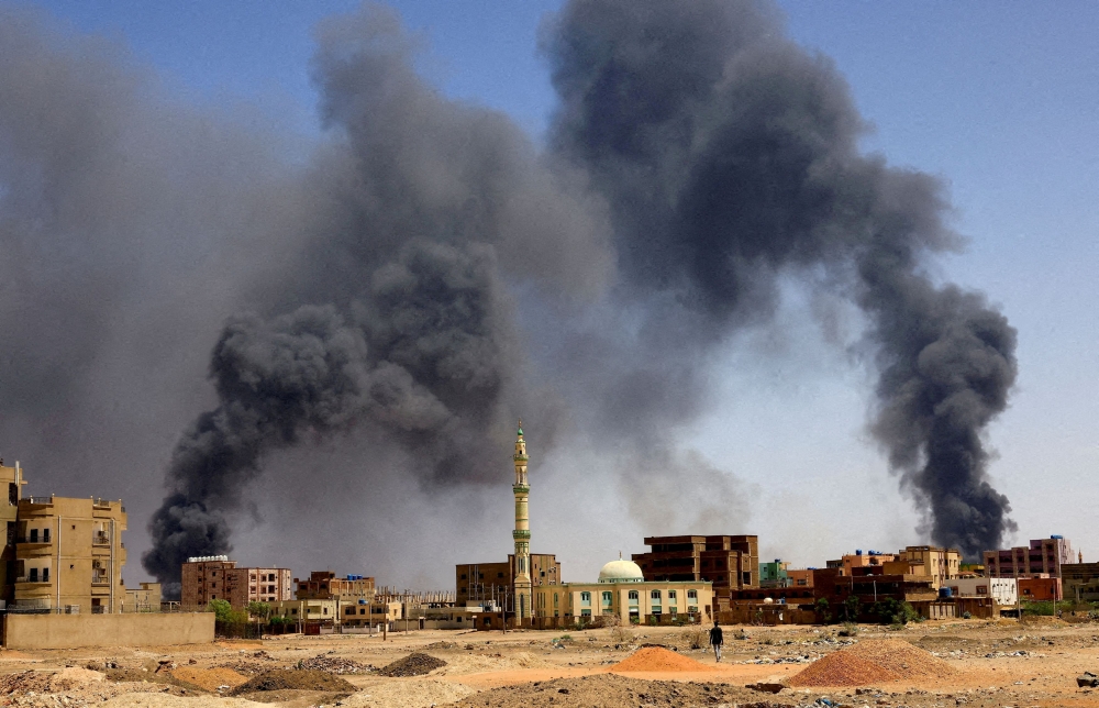 Smoke rises above buildings after aerial bombardments during clashes between the paramilitary Rapid Support Forces and the army in Khartoum North, Sudan, May 1, 2023. — Reuters pic