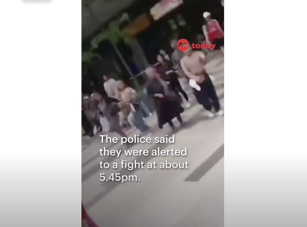 In a minute-long video published on Facebook group 'Complaint Singapore', a man can be seen being shoved and hit by two women, while several people try to hold the two women back. — YouTube screenshot