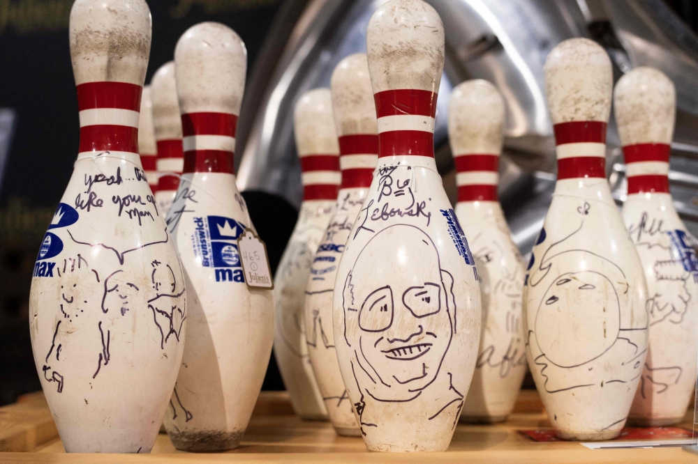 Signed film replica bowling pins from ‘The Big Lebowski’ are displayed during Julien’s Auction’s press preview ahead of the public exhibition and auction ‘Hollywood Legend’ presented by Julien’s Auction and Turner Classic Movies (TMC) on December 11, 2023 at Julien’s Auction in Gardena, California. — AFP pic