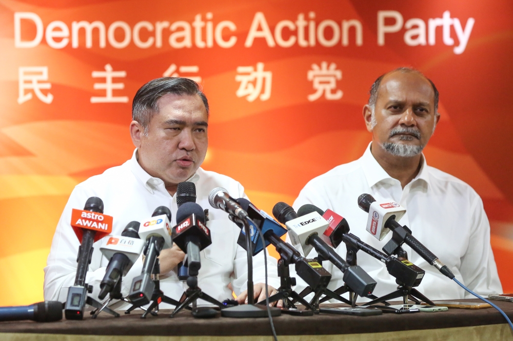 DAP secretary-general Anthony Loke speaks during a press conference at the party headquarters in Kuala Lumpur, December 12, 2023. With him is Digital Minister Gobind Singh Deo. — Picture by Yusof Mat Isa