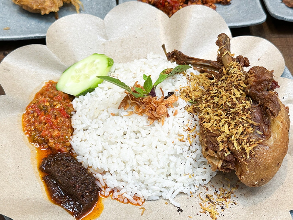 Dig into the Nasi Lemak Bebek Madura with its 'bebek goreng', 'sambals' and fragrant rice — Pictures by Lee Khang Yi