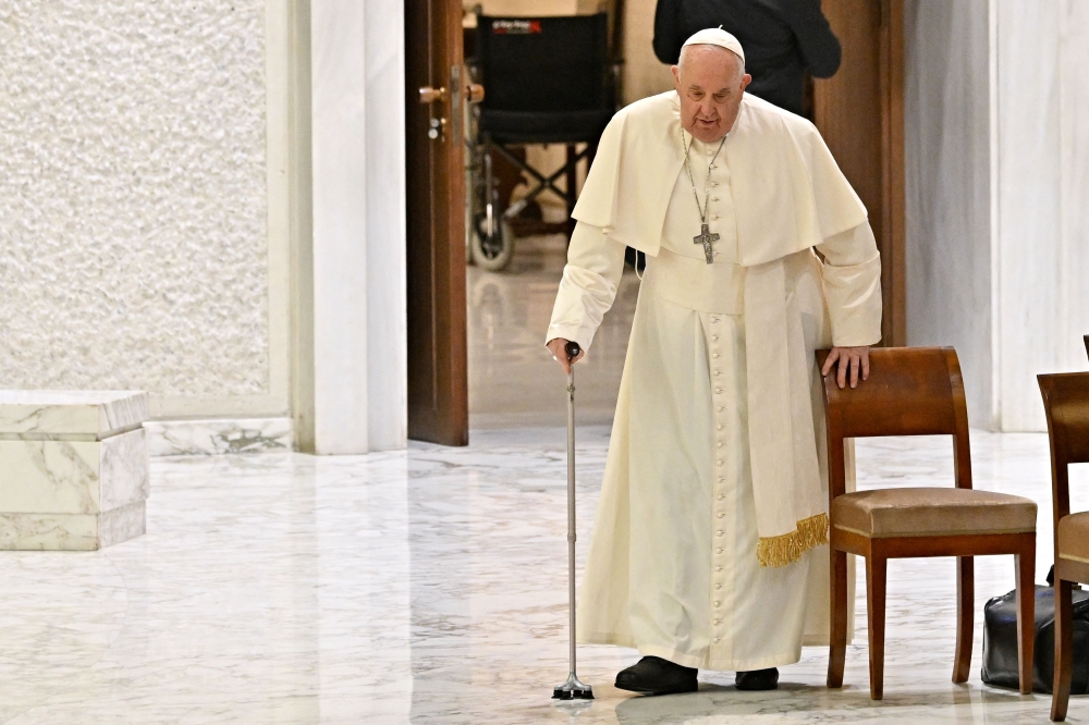 Pope Francis arrives for the weekly general audience in Paul-VI hall at the Vatican December 13, 2023. — AFP pic