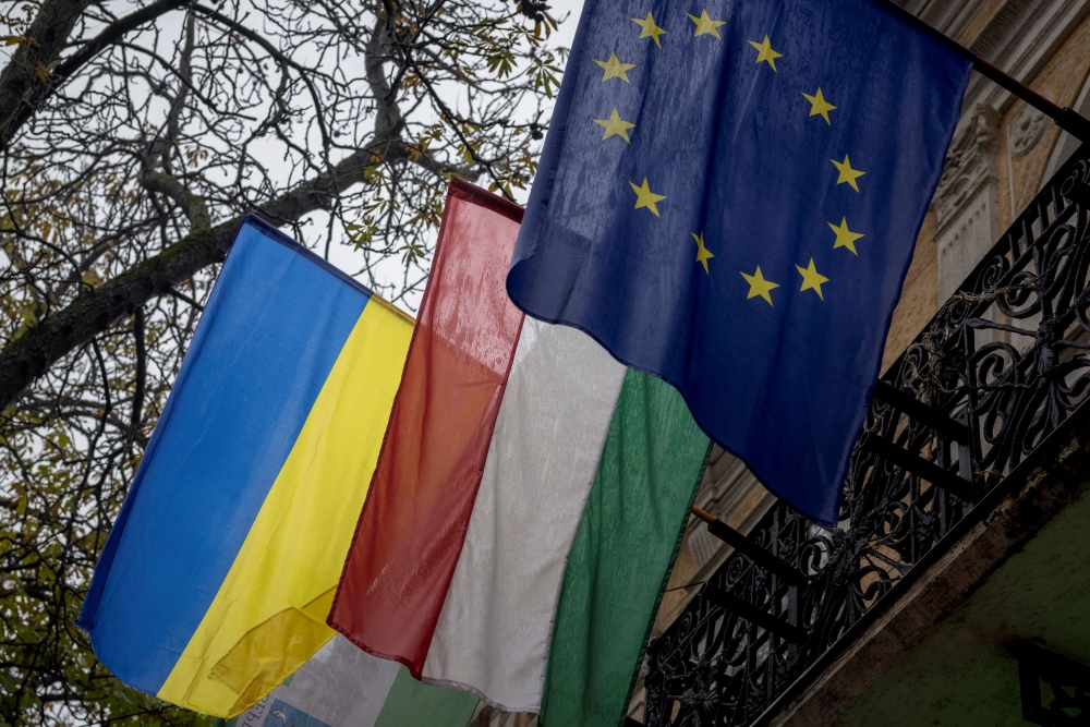 Flags of Ukraine, Hungary and the European Union are seen in the town of Berehove, which has a sizeable minority of ethnic Hungarians, amid Russia's attack on Ukraine, in Zakarpattia region, Ukraine December 1, 2023. — Reuters pic  