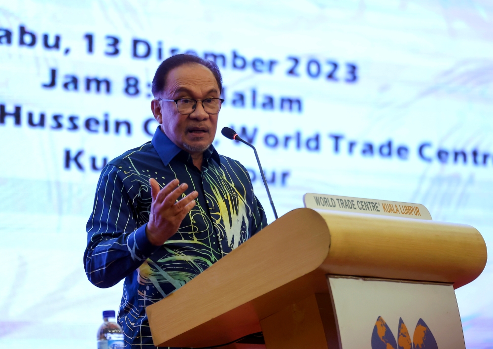 Prime Minister Datuk Seri Anwar Ibrahim speaks during the Administrative and Diplomatic Officers Alumni (Alumni PTD) and Yayasan Alumni PTD dinner at the World Trade Centre in Kuala Lumpur December 13, 2023. ― Bernama pic