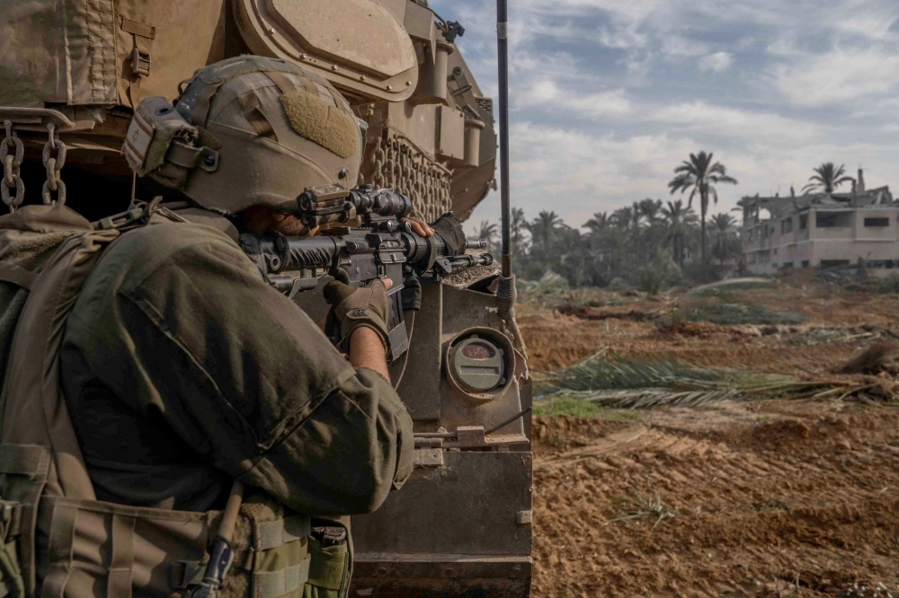 An Israeli soldier operates in the Gaza Strip amid the ongoing conflict between Israel and the Palestinian Islamist group Hamas, in this handout picture released on December 14, 2023. — Picture by Israel Defense Forces/Handout via Reuters