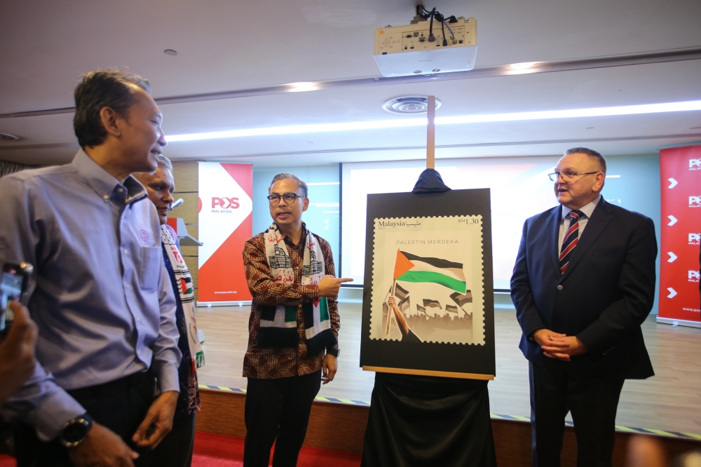 Communications Minister Fahmi Fadzil at the launch of Pos Malaysia’s stamp series commemorating Palestine at Dayabumi Complex, December 14, 2023. — Picture by Ahmad Zamzahuri