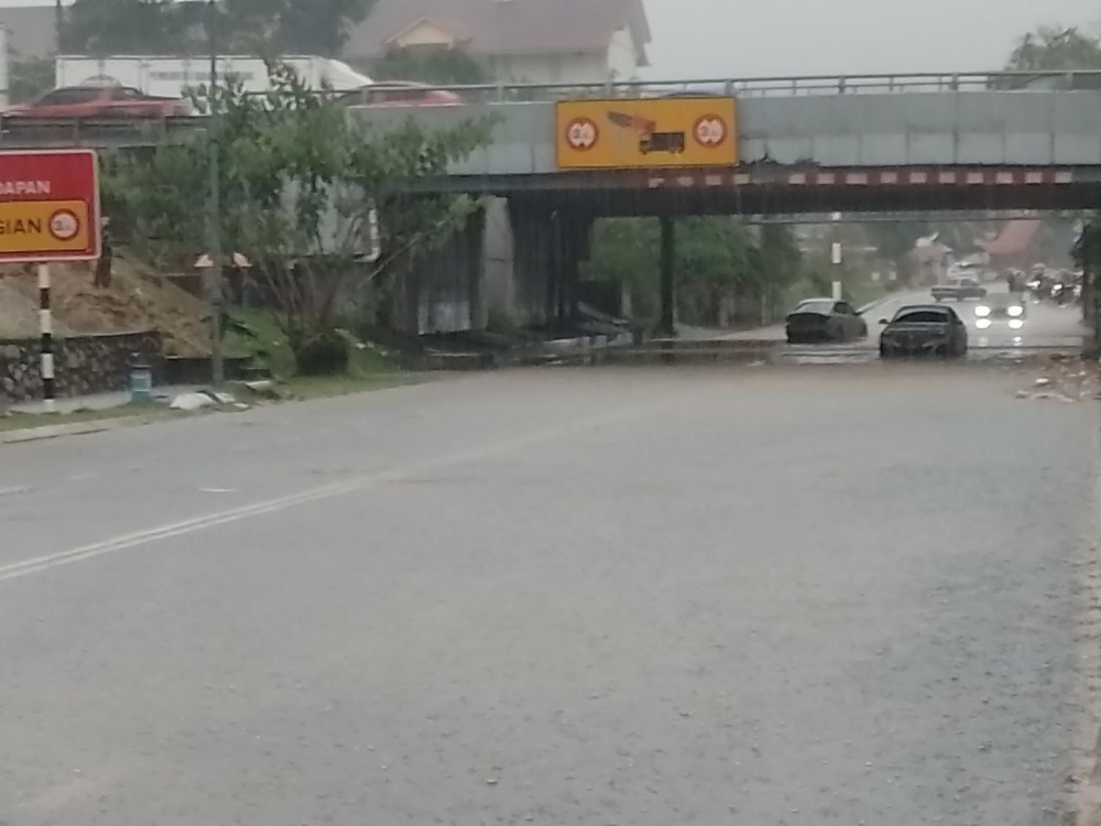 Part of Jalan Persiaran Molek Utama in Taman Molek, Johor Baru that was inundated by flash floods following an afternoon downpour, December14, 2023. — Picture courtesy of the Johor Fire and Rescue Department
