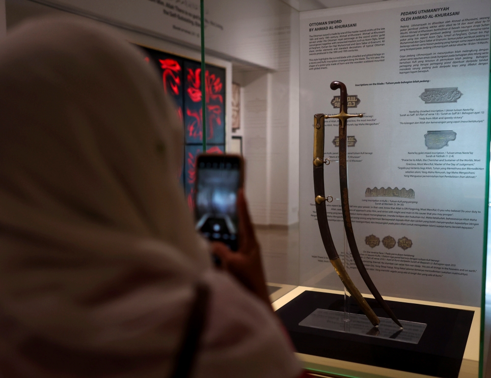 A visitor takes a picture of an Ottoman sword. — Bernama pic 