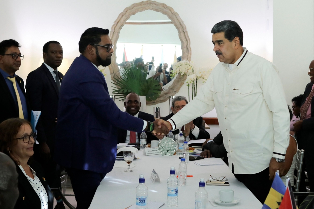 This handout picture released by the Venezuelan Presidency shows Venezuela’s President Nicolas Maduro ®shakes hand with Guyana’s President Irfaan Ali(left) during a meeting in Saint Vincent and The Grenadines on December 14, 2023. — Picture by Marcelo Garcia/Venezuelan Presidency via AFP