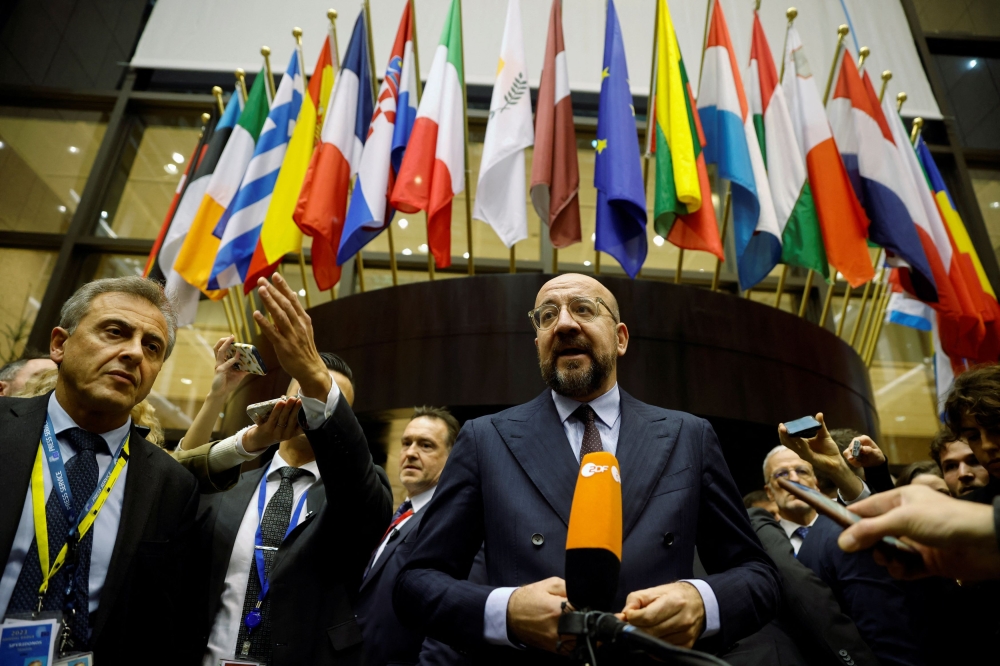 European Council President Charles Michel speaks to members of the media, on the day of the European Union and Western Balkans leaders’ summit, in Brussels December 14, 2023. — Reuters pic