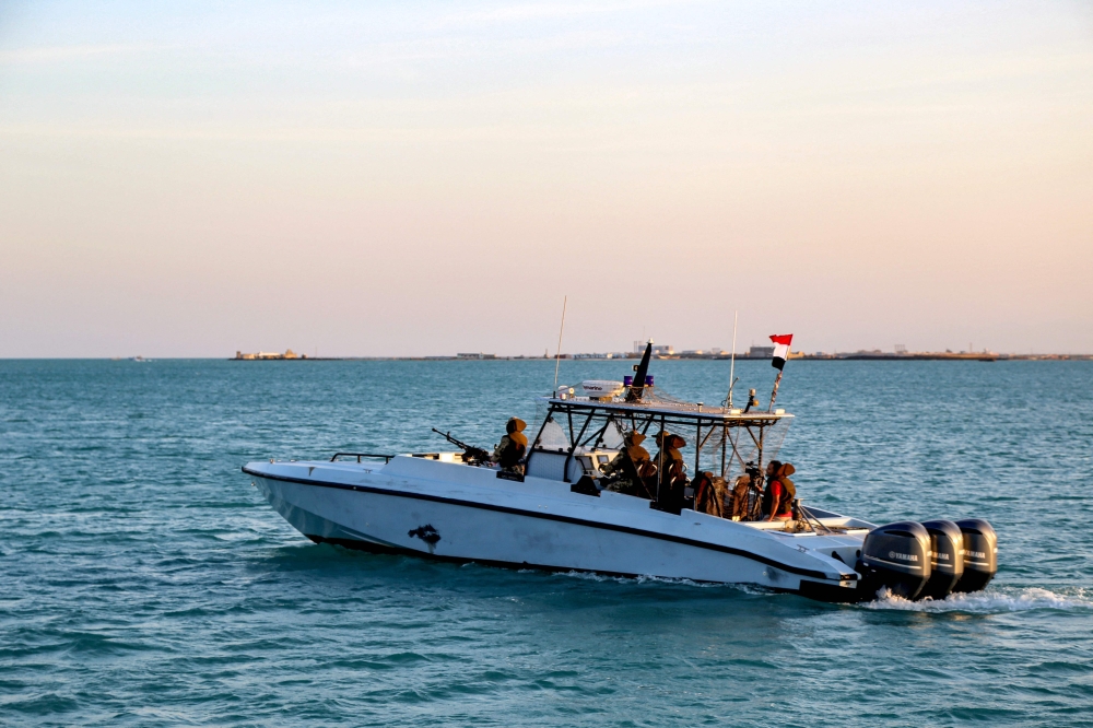 Yemeni coastguard members loyal to the internationally-recognised government ride in a patrol boat in the Red Sea off of the government-held town of Mokha in the western Taiz province, close to the strategic Bab al-Mandab Strait, on December 12, 2023. — AFP pic