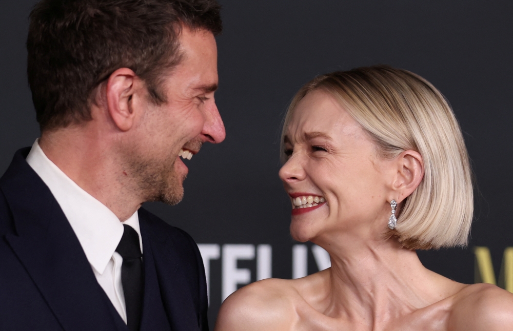 Cast members Bradley Cooper and Carey Mulligan attend the red carpet of the Netflix movie ‘Maestro’ at the Academy Museum of Motion Pictures in Los Angeles, California December 12, 2023. — Reuters pic  