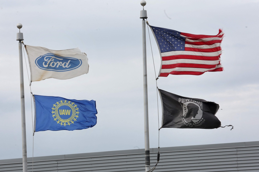Flags fly outside of Ford's Chicago Assembly Plant on October 26, 2023 in Chicago, Illinois. — AFP pic