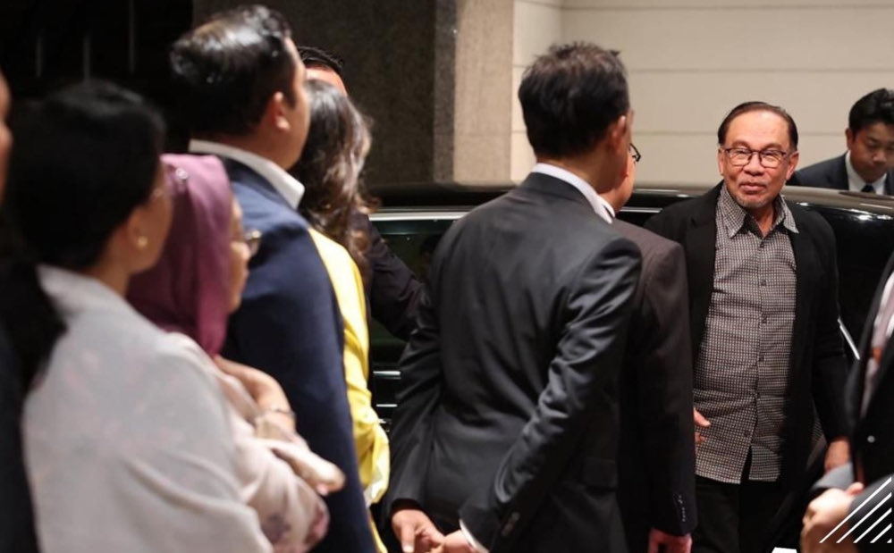 Prime Minister Datuk Seri Anwar Ibrahim is greeted by Malaysian staffers in Japan, upon his arrival, December 15, 2023. — Bernama pic