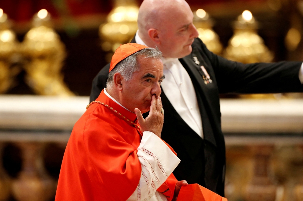 Cardinal Angelo Becciu (pic), a one-time Vatican power broker, is charged with embezzlement, abuse of office and trying to induce a witness to give false testimony. — Reuters pic