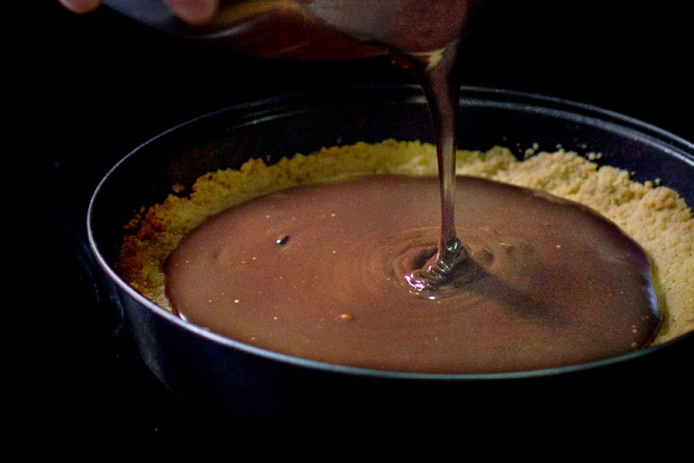 Chill the tart until the filling has set before slicing and serving.