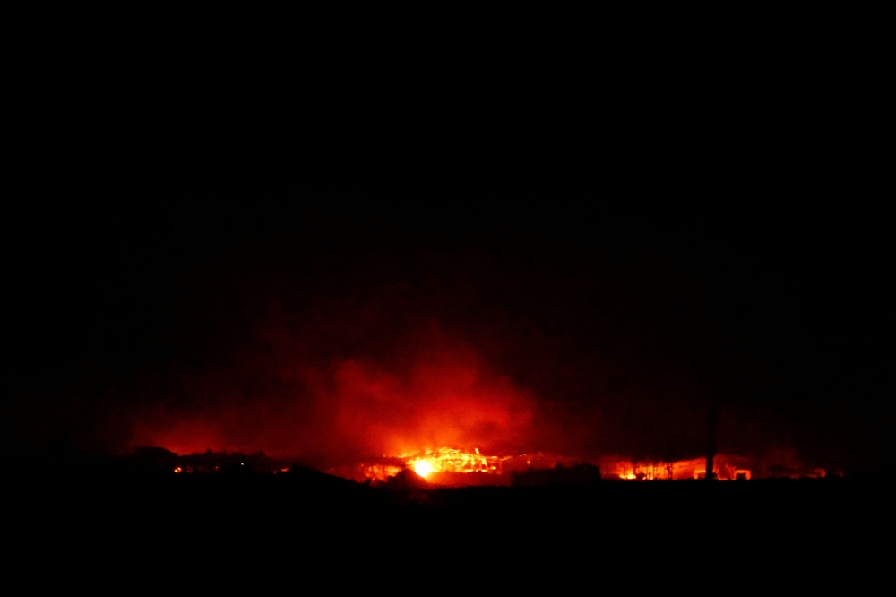 Fire burns in Gaza, amid the ongoing conflict between Israel and the Palestinian Islamist group Hamas, as seen from southern Israel, December 15, 2023. — Reuters pic