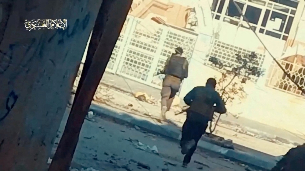 File photo of Hamas fighters running across the street at Rantissi hospital, amid the ongoing conflict between Israel and the Palestinian Islamist group Hamas, in Gaza City, in this screen grab taken from a handout video released on November 19, 2023. — Reuters pic