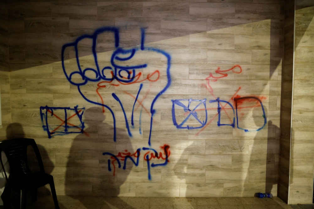 A view of blue Israeli graffiti following an Israeli raid, amid the ongoing conflict between Israel and the Palestinian Islamist group Hamas, in Jenin camp, in the Israeli-occupied West Bank December 14, 2023. — Reuters pic